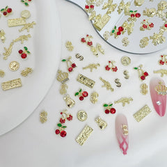 Pizadix gold nail charms with cherries spark a playful, vibrant manicure
