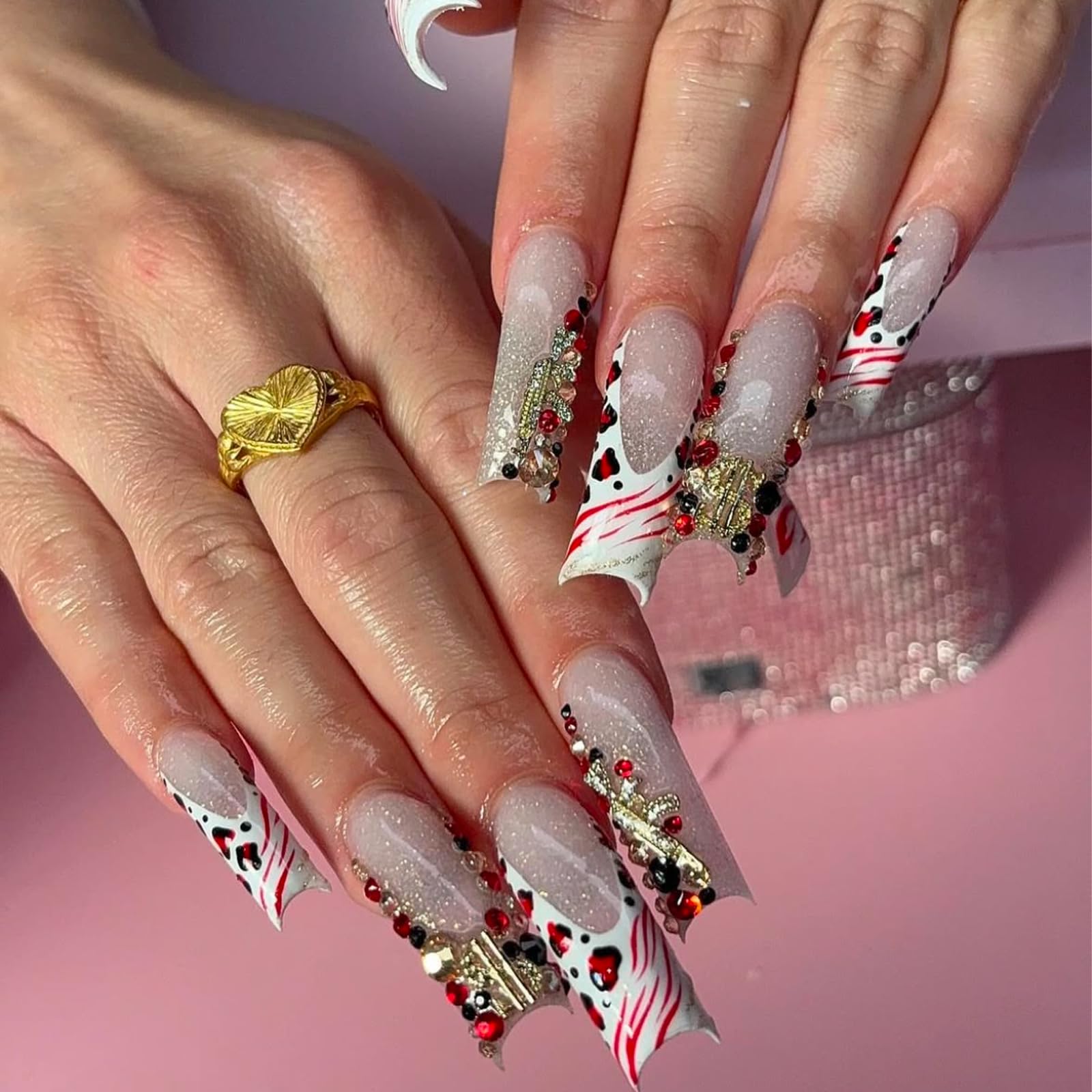 Pizadix gold nail charms with guns add edgy accents for bold looks