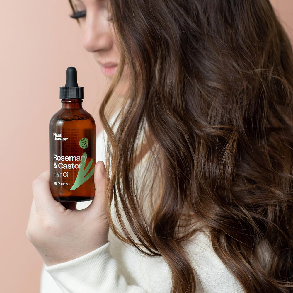 Plant Therapy rosemary-oil bottle with herbal aroma supports refreshing scalp routine.