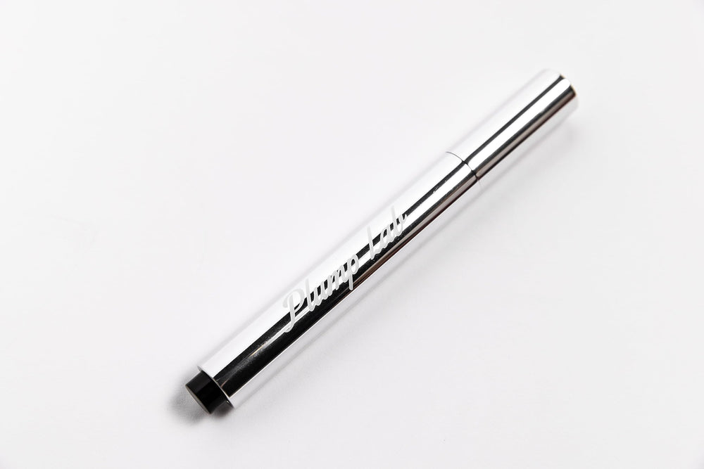 Plump Lab Lip Plumper Gloss on lips closeup shows defined contour and shine.
