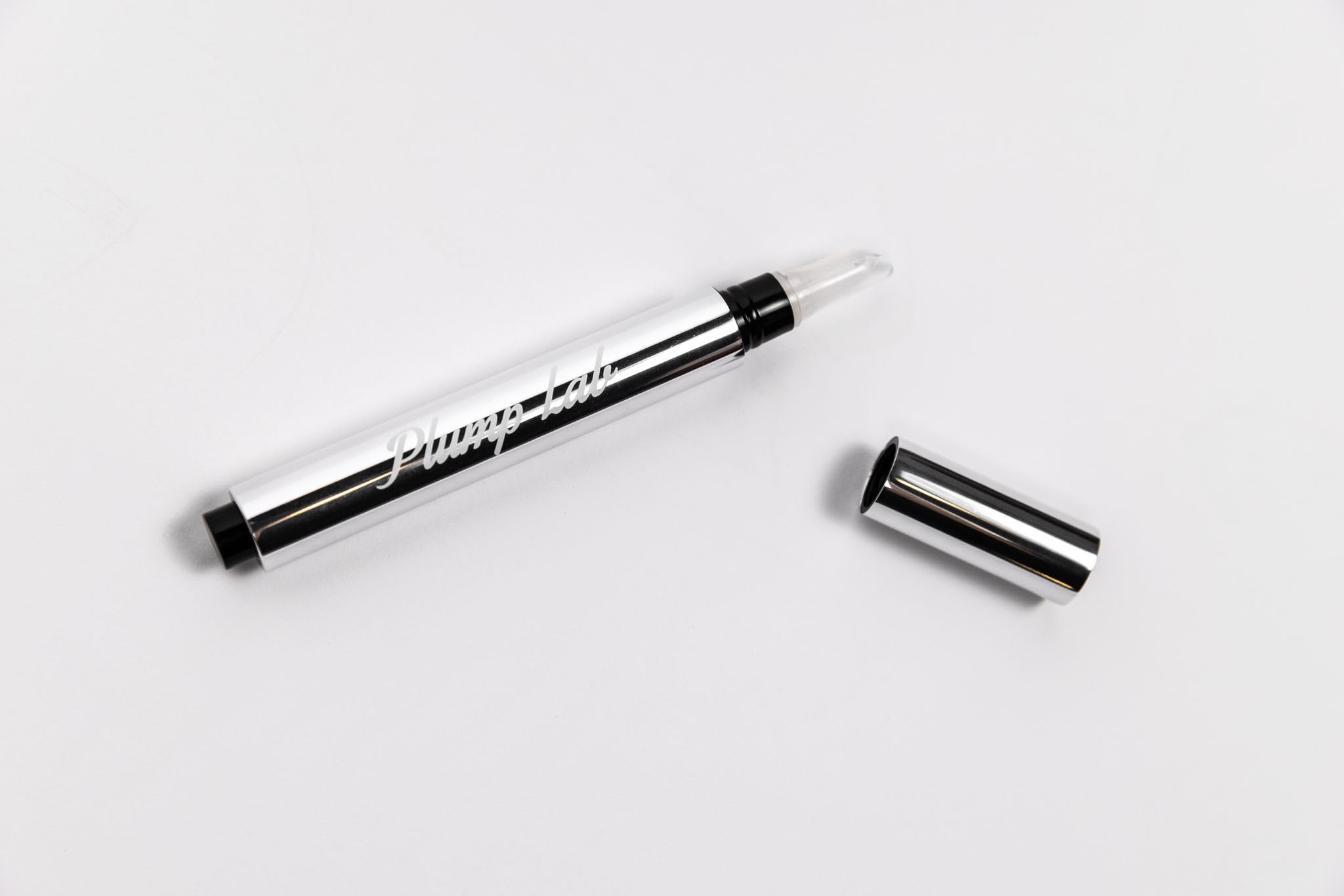 Plump Lab Lip Plumper Gloss texture detail highlights smooth, nourished lips.