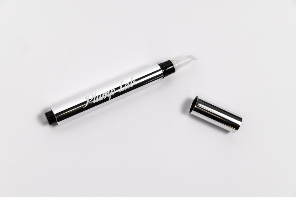 Plump Lab Lip Plumper Gloss texture detail highlights smooth, nourished lips.