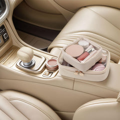 Pocmimut car-friendly makeup bag in vehicle console for easy beauty access.