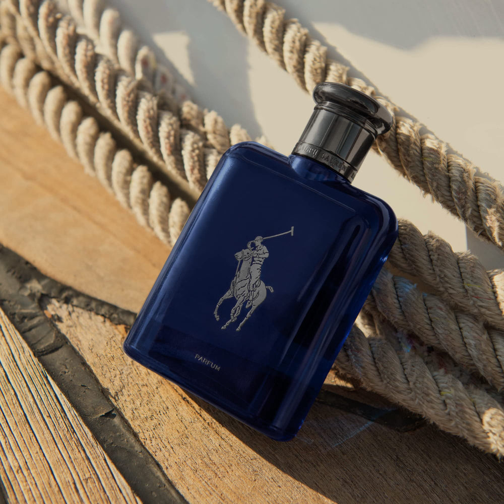 Upcycled oakwood from cognac barrels imagery paired with the refillable navy bottle.