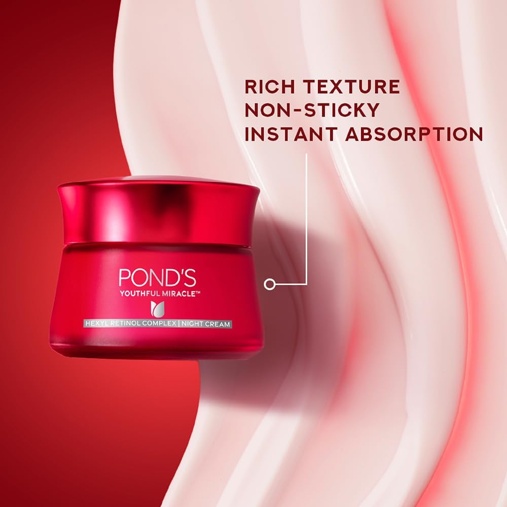 POND'S Age Miracle day cream on hand demonstrates easy, light absorption.