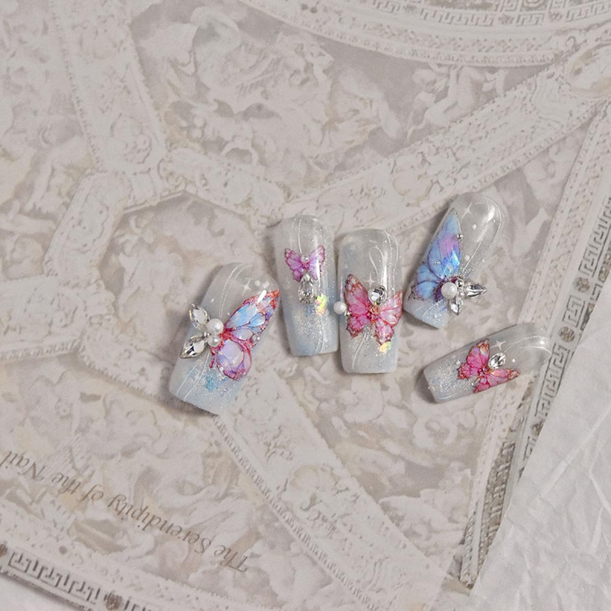 POWPOP butterfly nail art enhances color with an elegant shell motif.