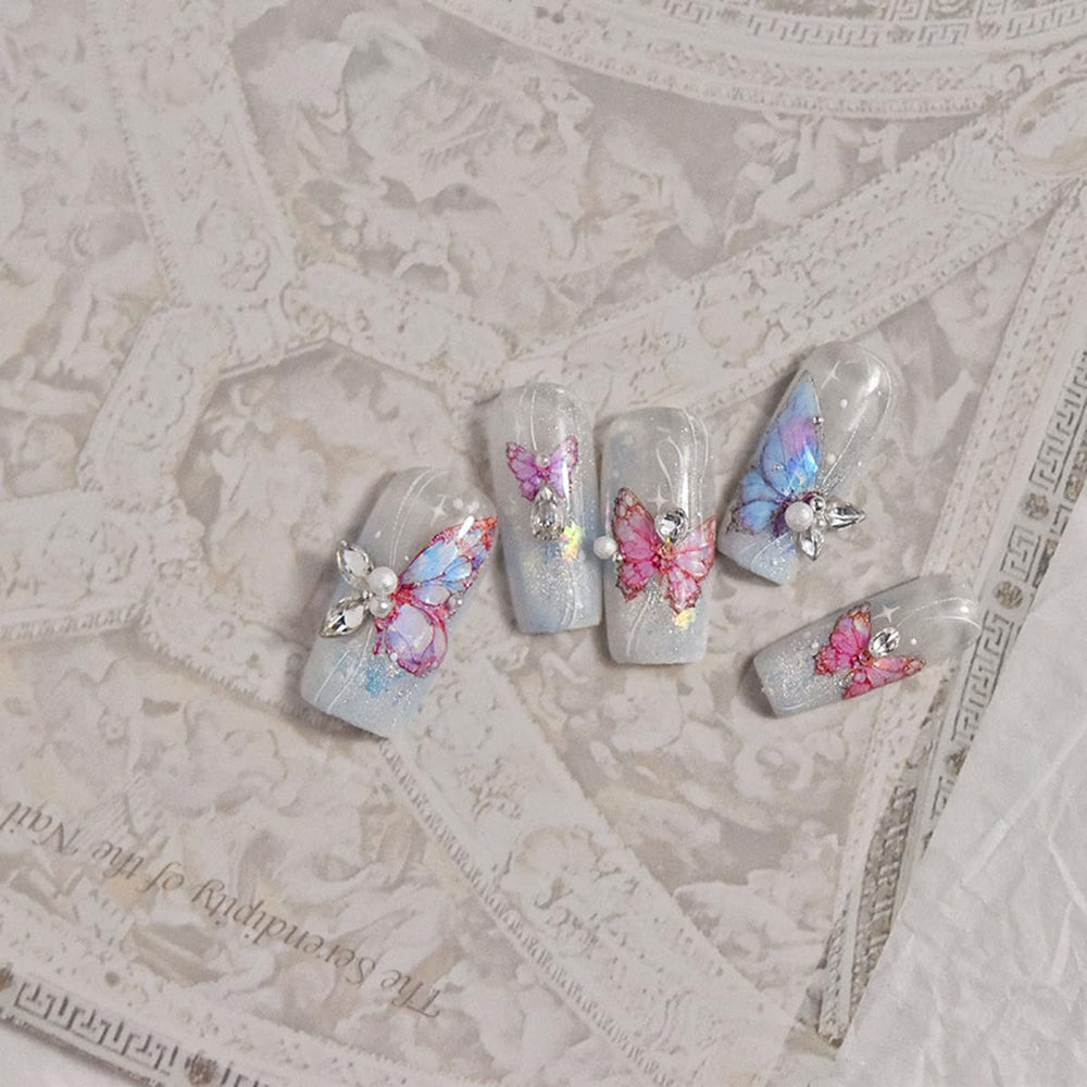POWPOP butterfly nail art enhances color with an elegant shell motif.