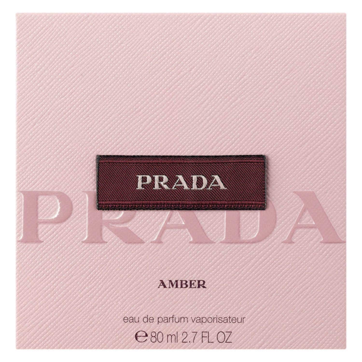 Prada Amber bottle detail reveals metal plaque and refined finish for evening wear