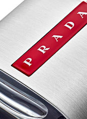 Prada Luna Rossa cap detail emphasizes luxury and secure closure.