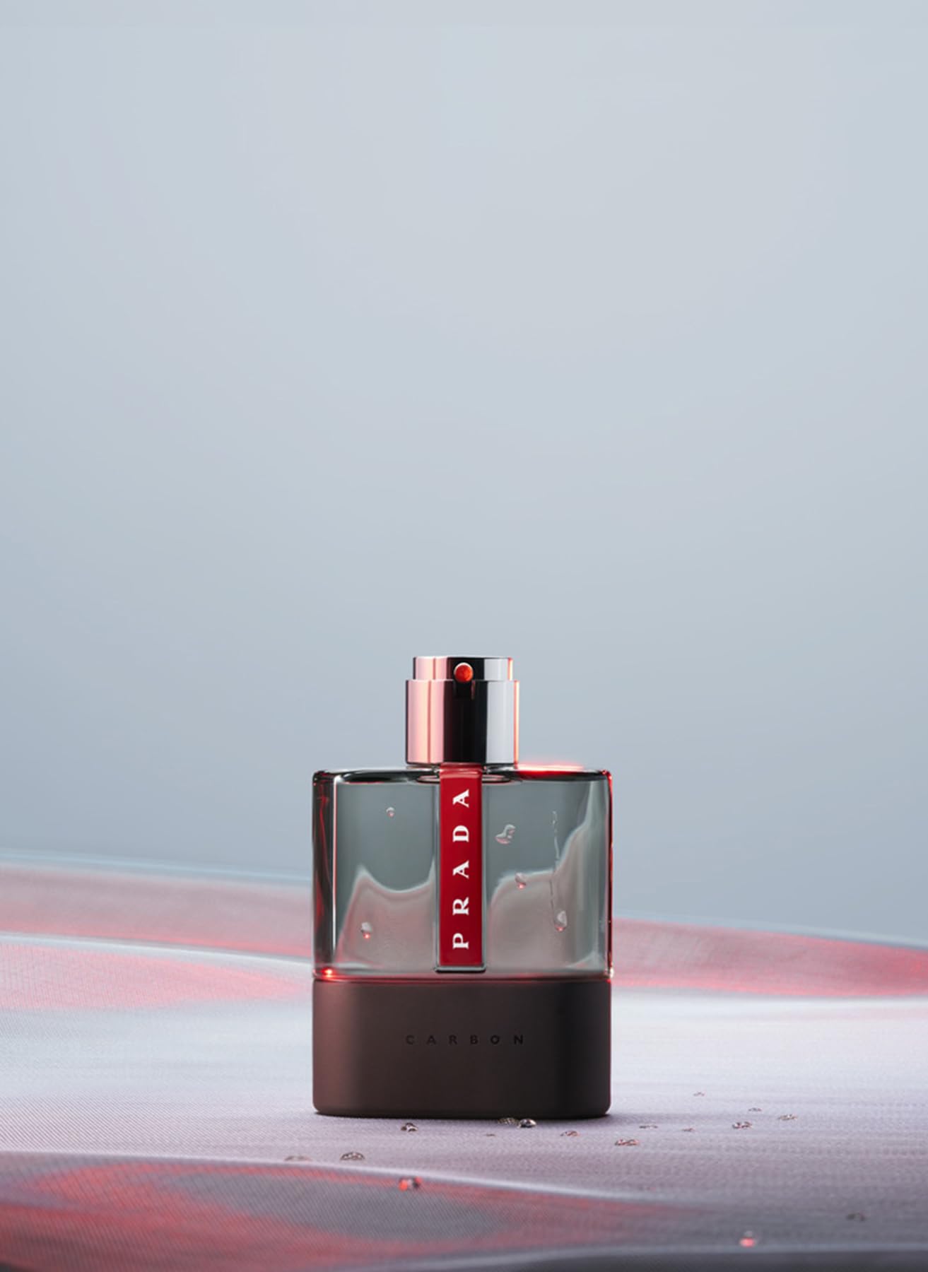 Prada Luna Rossa Carbon bottle angled view captures modern sport-chic lines.