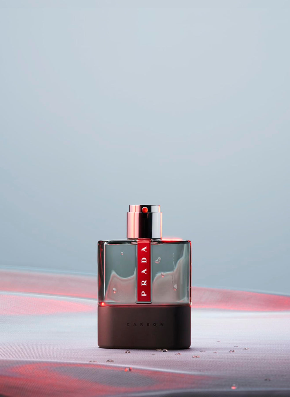 Prada Luna Rossa Carbon bottle angled view captures modern sport-chic lines.