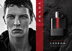 Prada Luna Rossa Carbon display with wooden texture background evokes premium grooming ritual.