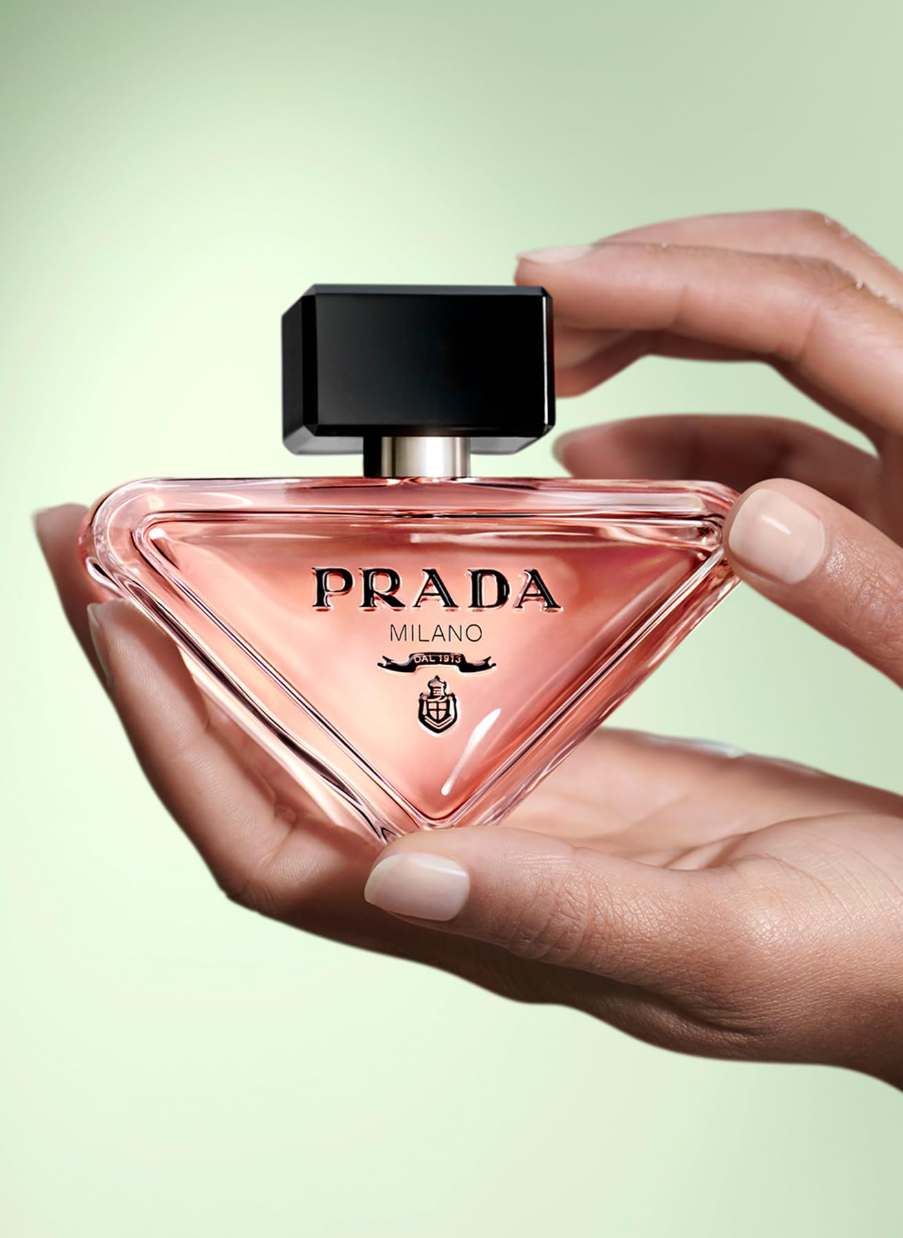 Prada Paradoxe spray application image hints easy, confident daily wear.