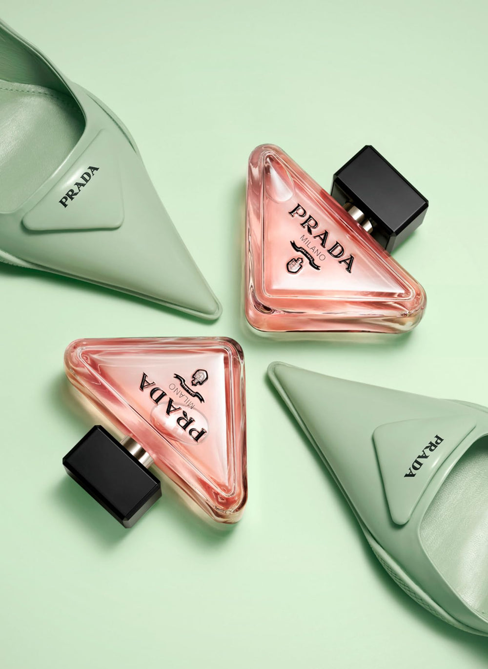 Prada Paradoxe bottle-cap close-up suggests elegant, premium fragrance experience.