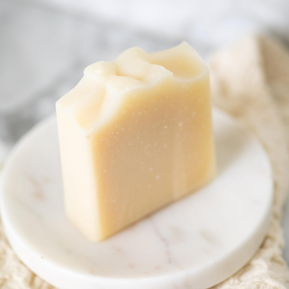 Pretty Farm Girl Pure Tallow + Honey Soap Bar closeup reveals creamy lather and goat milk richness.