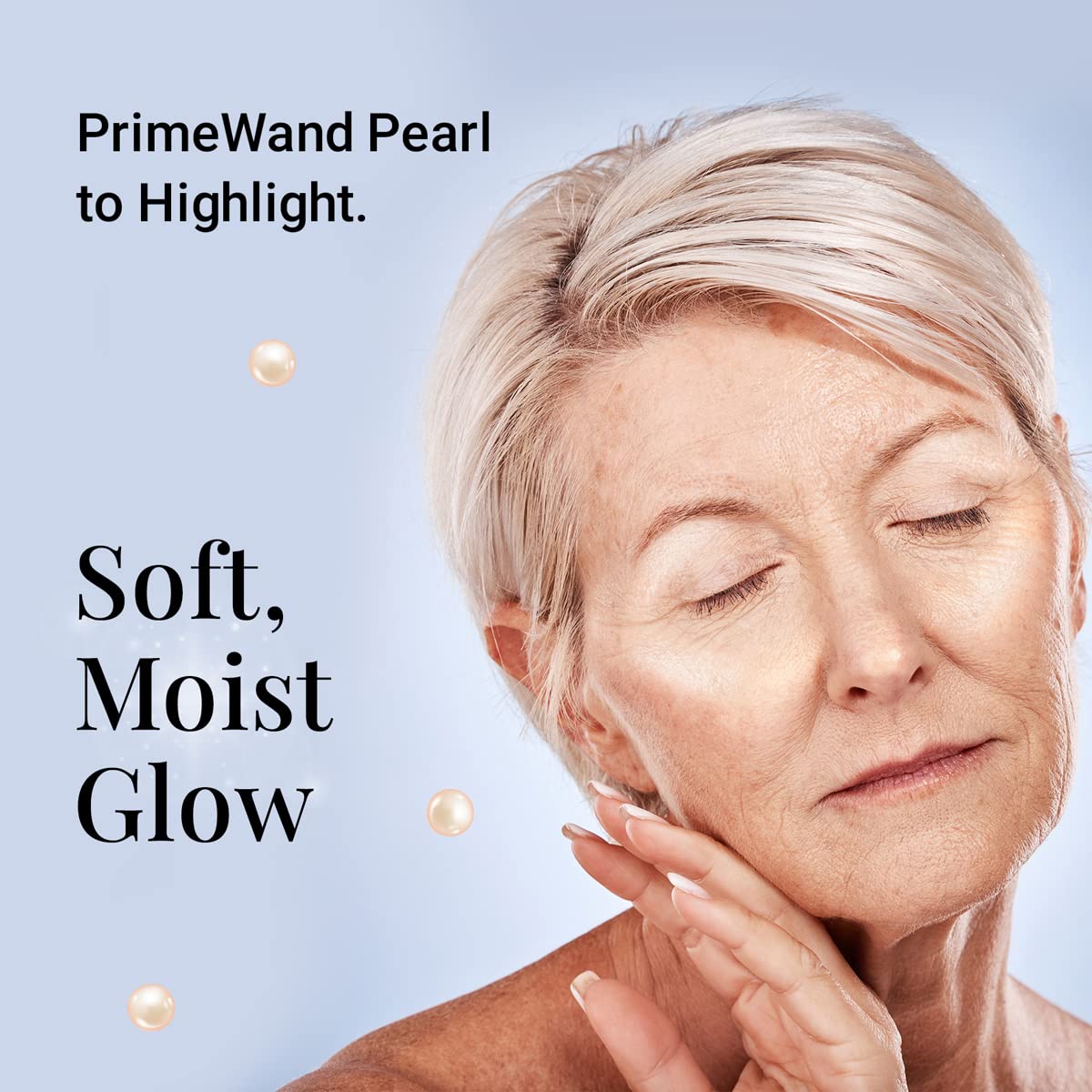 Prime Prometics PrimeWand Pearl cheek highlight on apple for natural radiance.