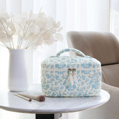 Prite makeup bag blue flower side pocket highlights easy-access compartments for travel essentials.