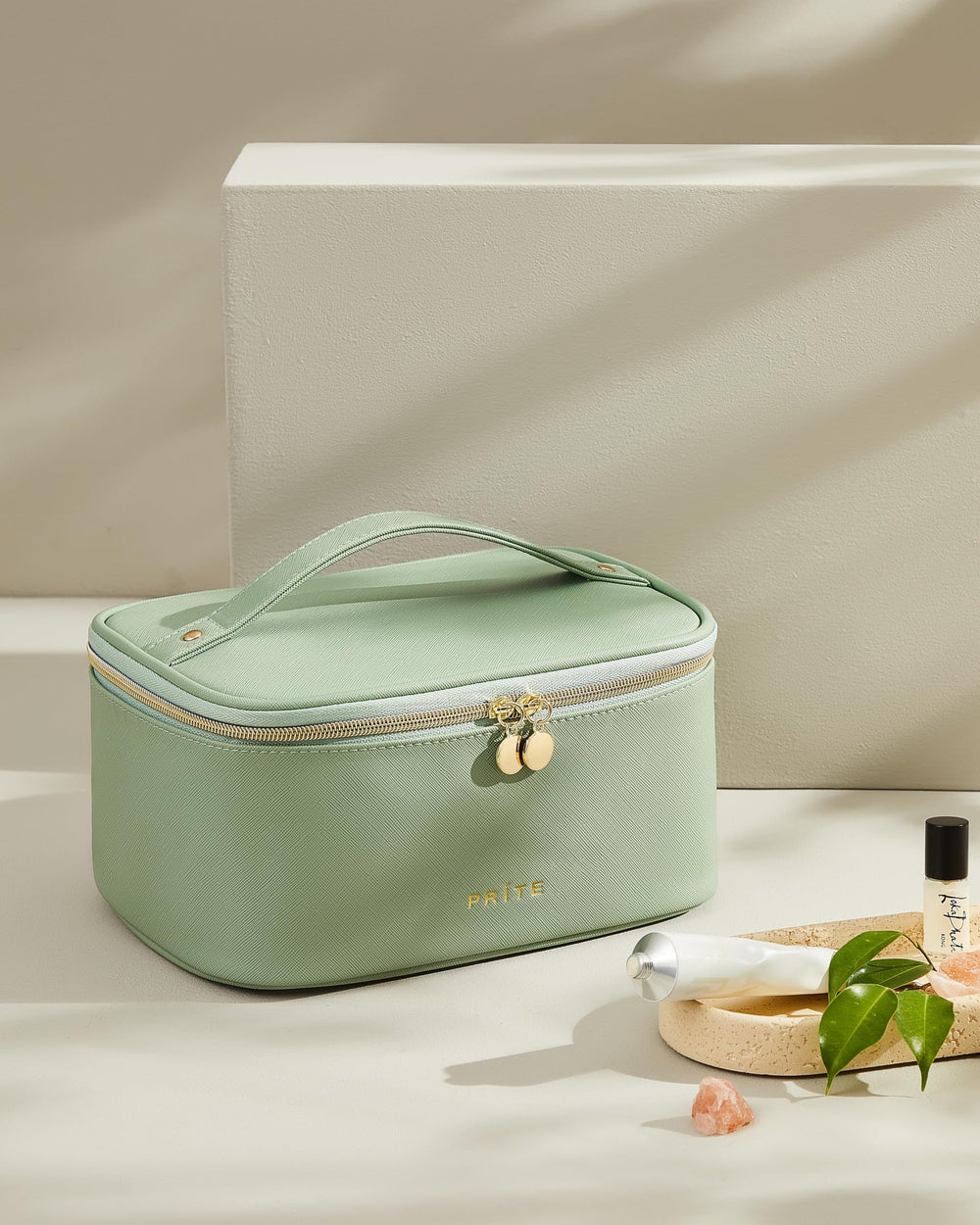 Prite makeup bag green vegan-leather shell provides durable waterproof protection.