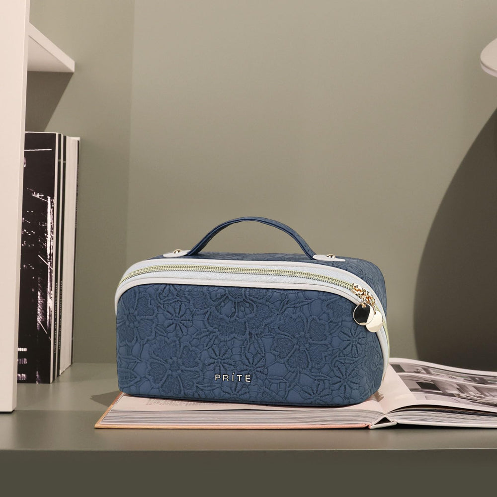 Prite travel cosmetic bag interior showing three compartments for easy organization.