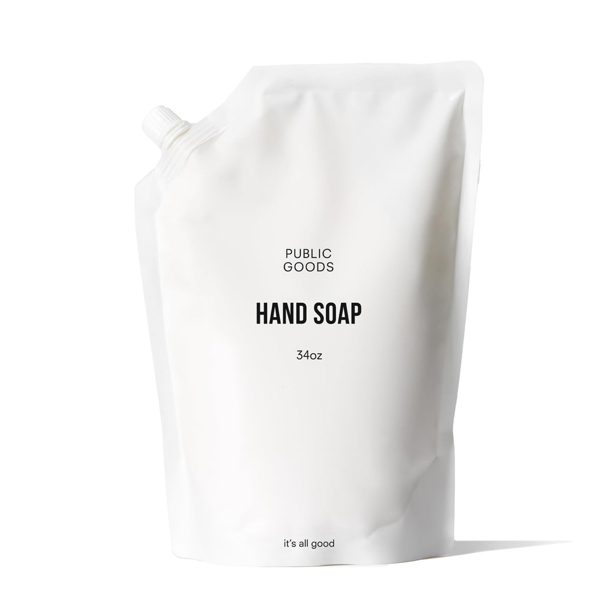Public Goods hand soap bottle on sink offering everyday cleansing with fresh grapefruit-mandarin scent.