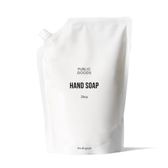 Public Goods hand soap bottle on sink offering everyday cleansing with fresh grapefruit-mandarin scent.