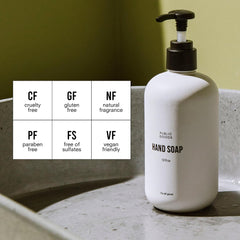 Public Goods Hand Soap bottle label close-up showing natural essential oils for a gentle cleanse.
