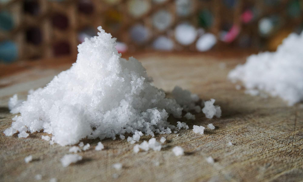 Pure Body Naturals Sitz Bath Salt dissolving in water demonstrates epsom salt-based muscle relief.