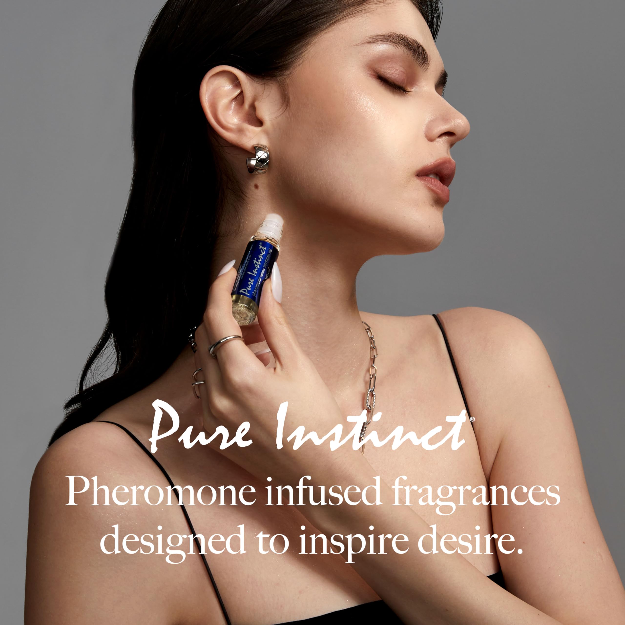 Pure Instinct Roll-On application on wrist, ideal for layering with other fragrances.