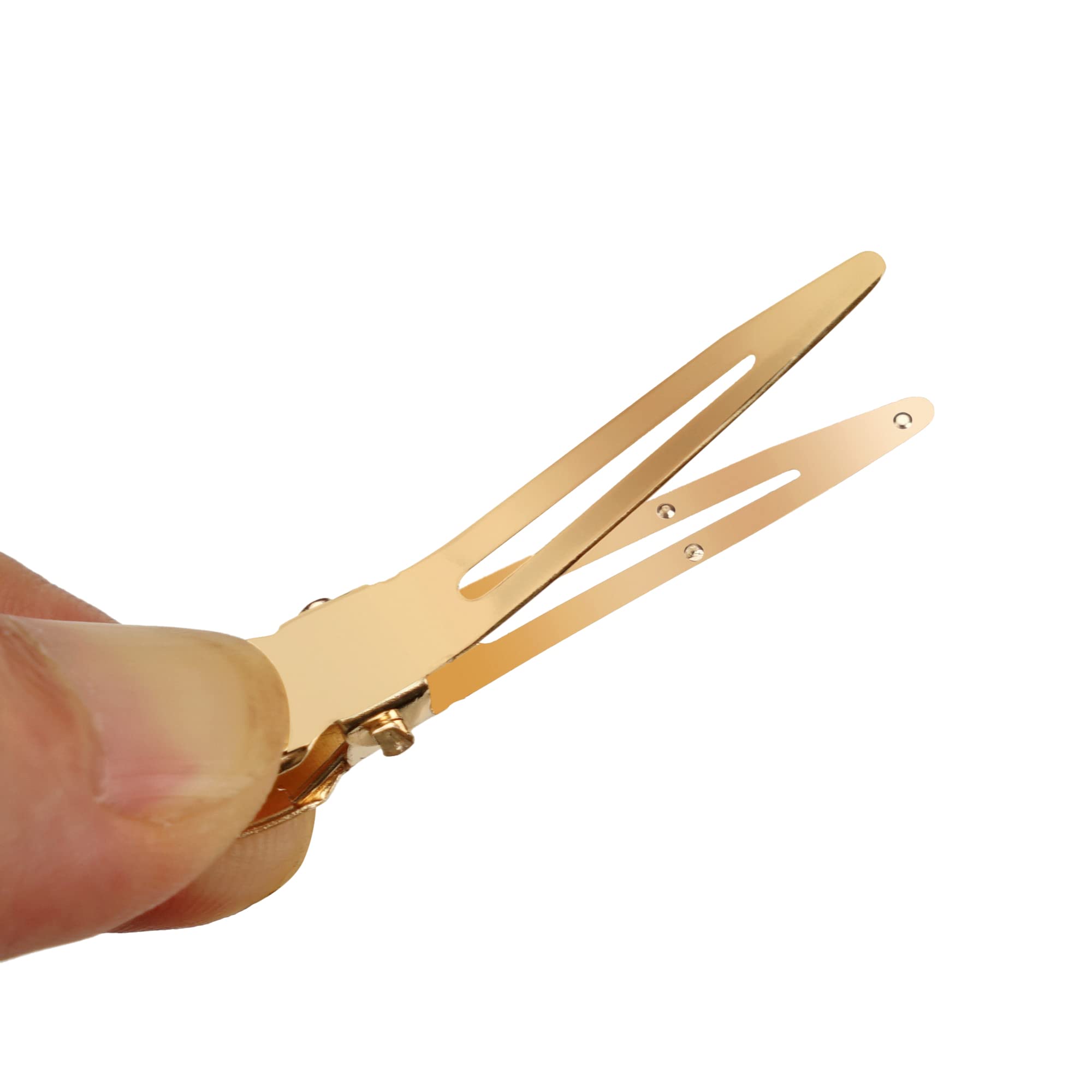 Qearl gold single-prong clip securing hair during cutting or blow-drying