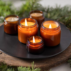 Qeirudu amber glass jar with black lid showing airtight seal for creams.