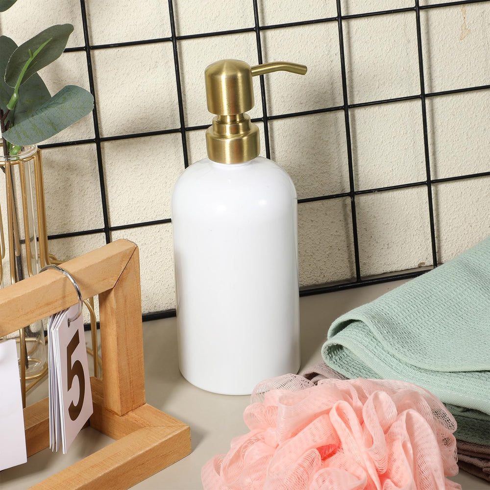 QfwdfcTrenz pump head with gold finish enhances dispenser aesthetics.