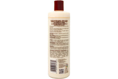 Queen Helene Cocoa Butter Lotion creamy texture closeup signals rich nourishment.