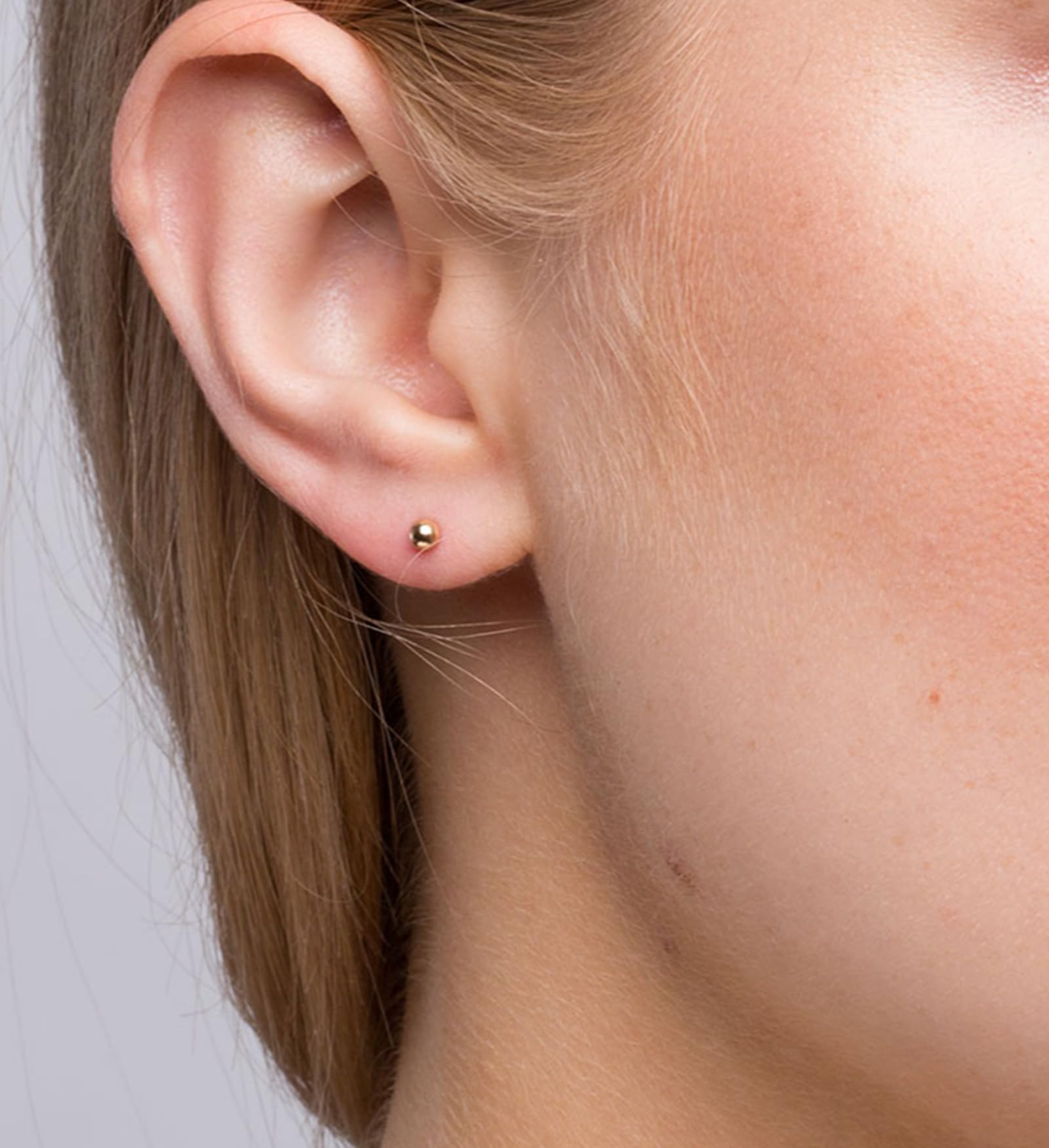 QWALIT clear ear-studs disposable for comfortable post-piercing wear