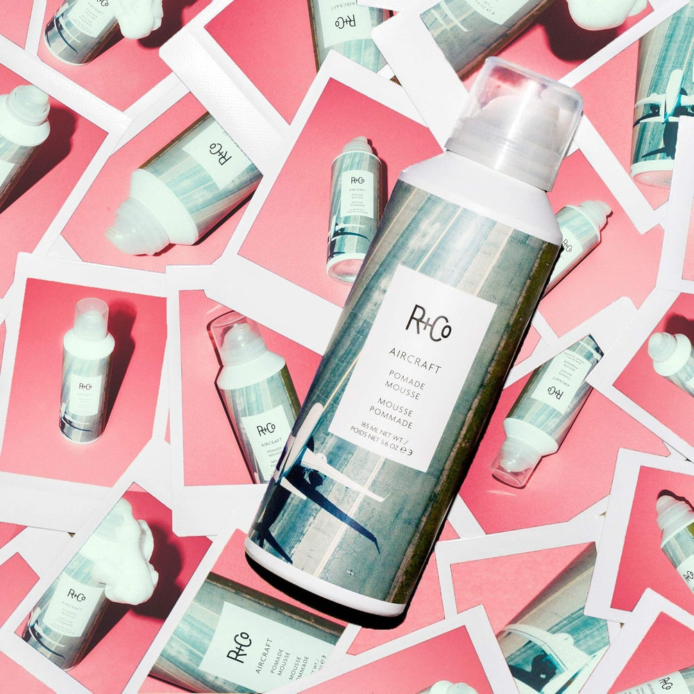 R+Co AIRCRAFT Pomade Mousse on wavy hair for defined curls with body.