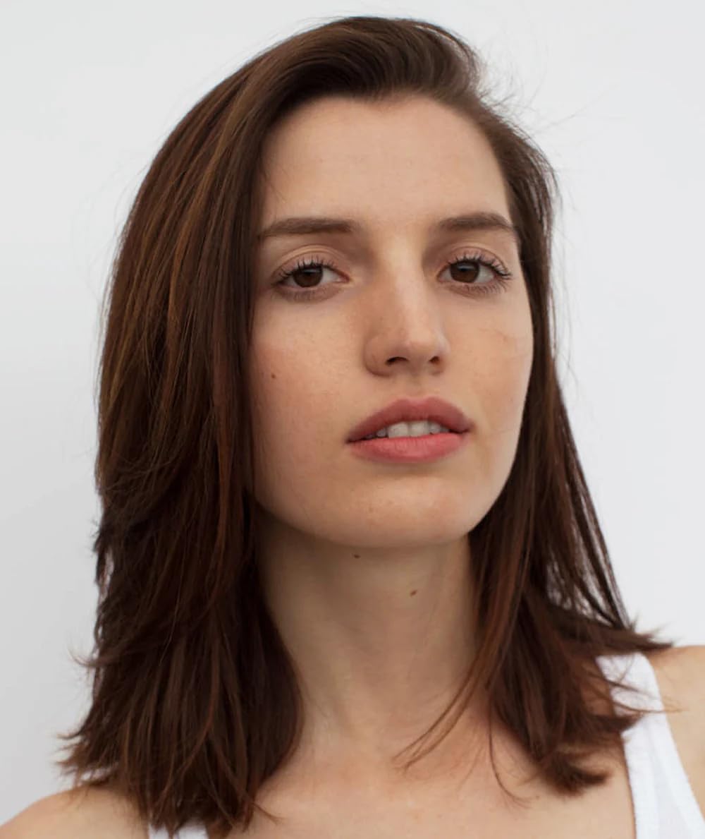 R+Co Atlantis shampoo application on wet hair in a shower setting