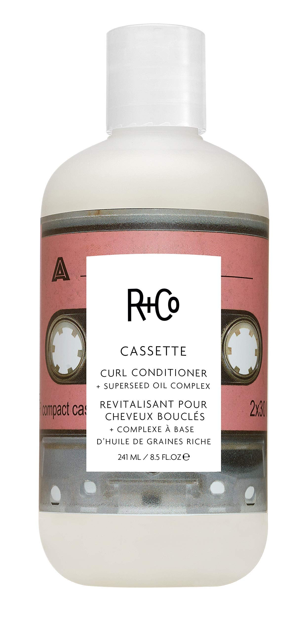R+Co Cassette bottle pump demonstrates moisturizing curl definition for daily care