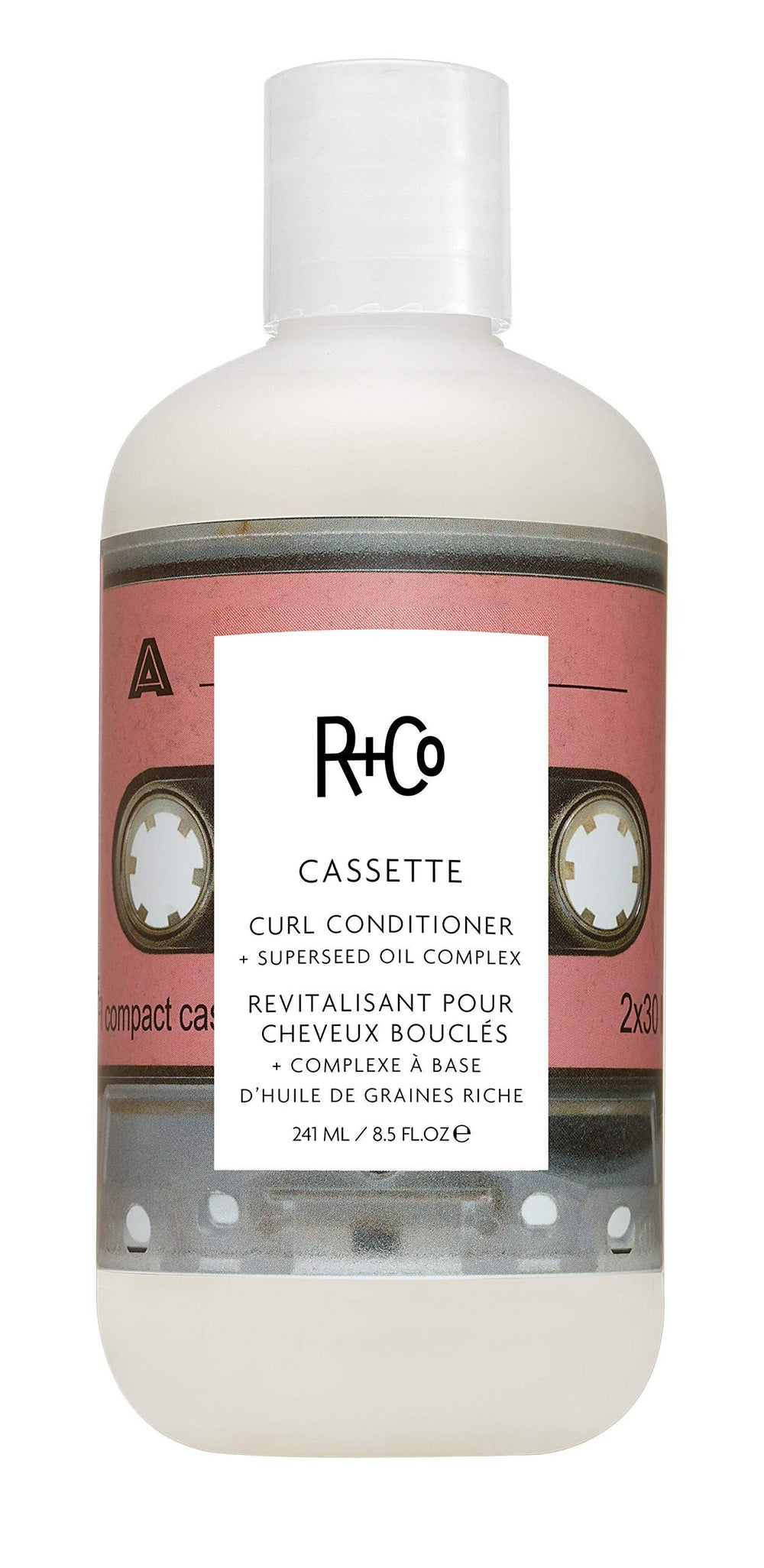 R+Co Cassette bottle pump demonstrates moisturizing curl definition for daily care