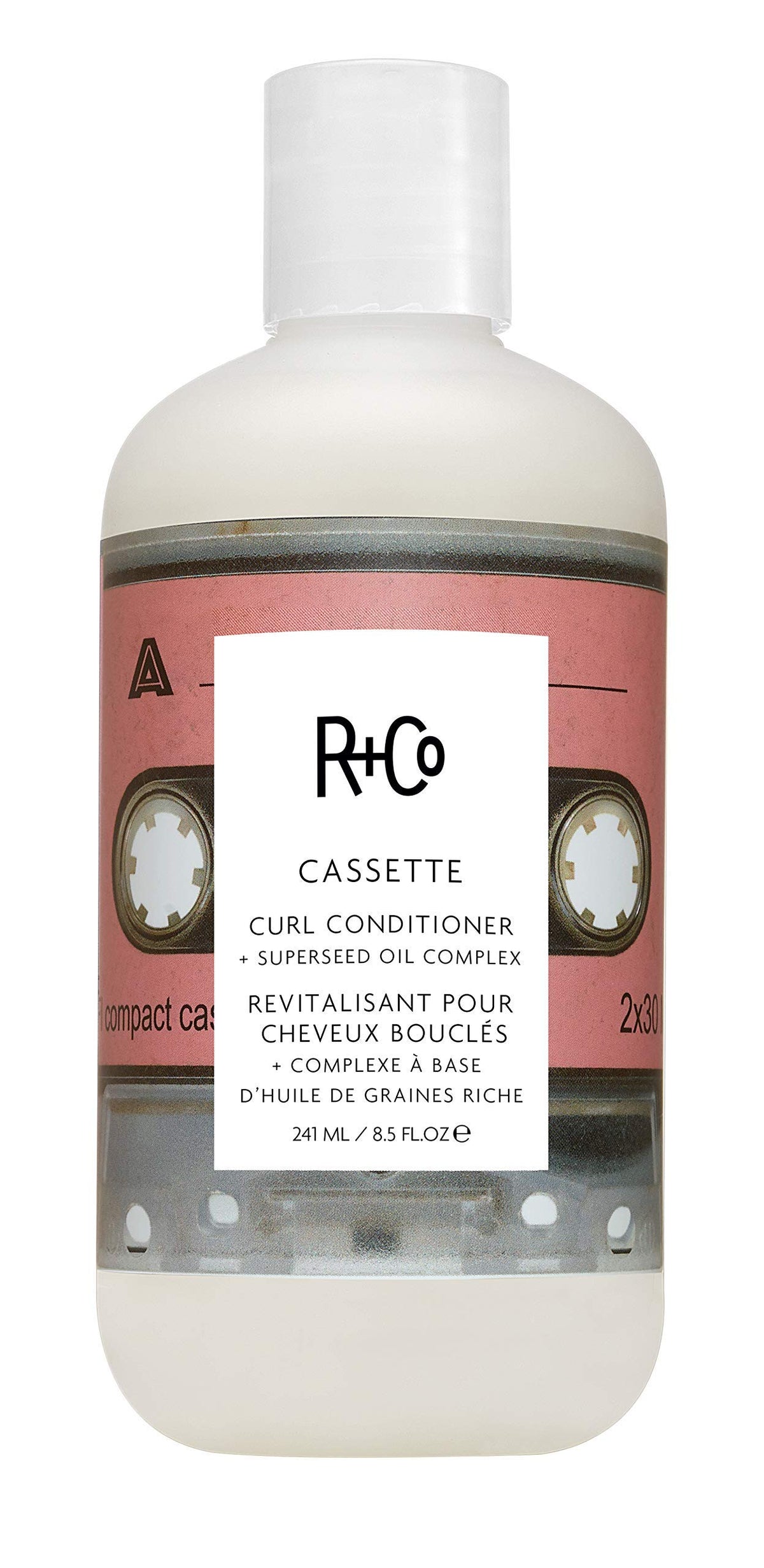 R+Co Cassette bottle pump demonstrates moisturizing curl definition for daily care