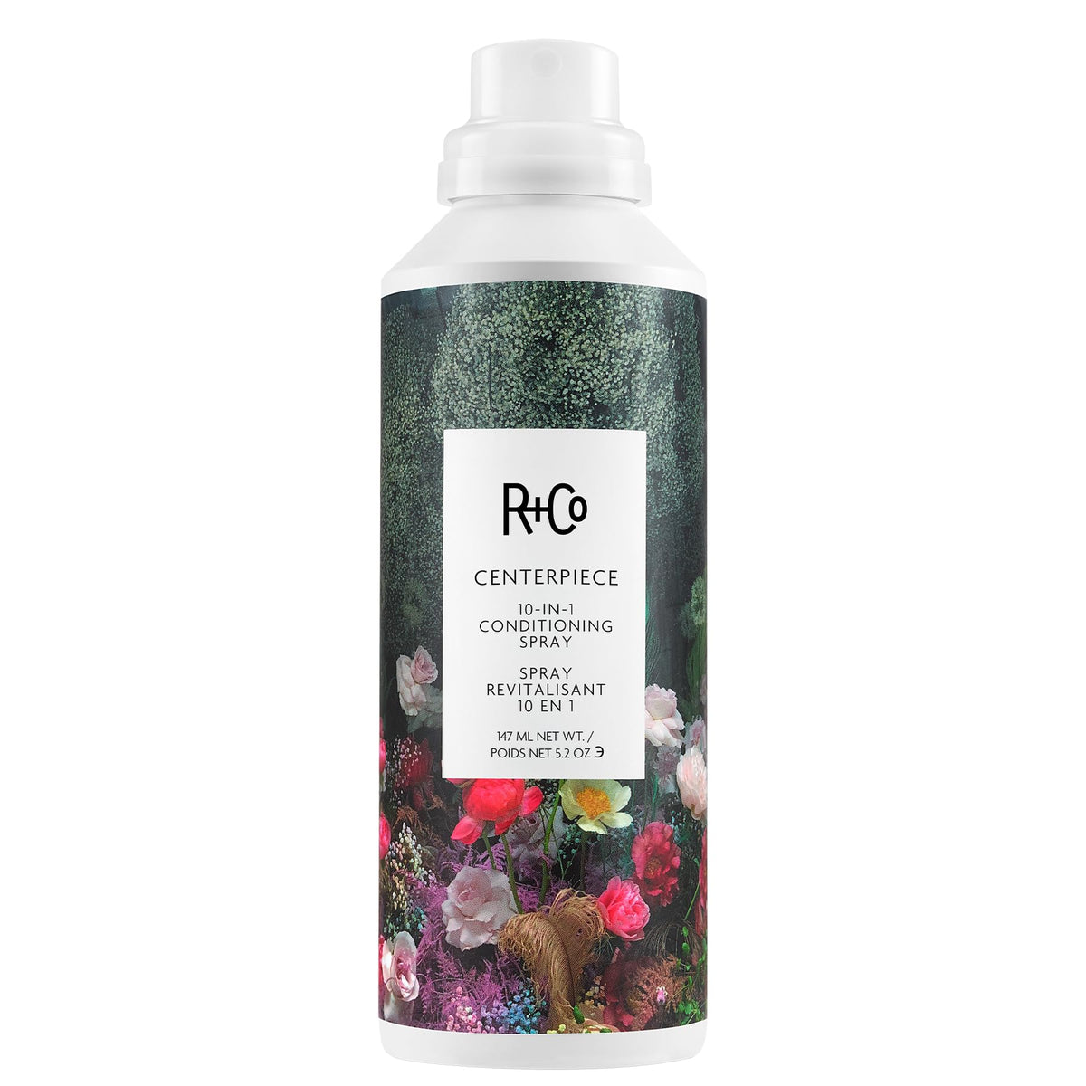 R+Co CENTERPIECE bottle closeup shows hydrating oils for smooth frizz-free hair