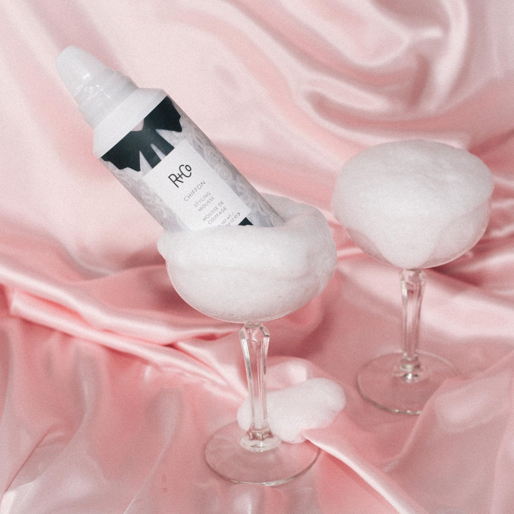 R+Co Chiffon Styling Mousse application image shows even distribution for soft texture