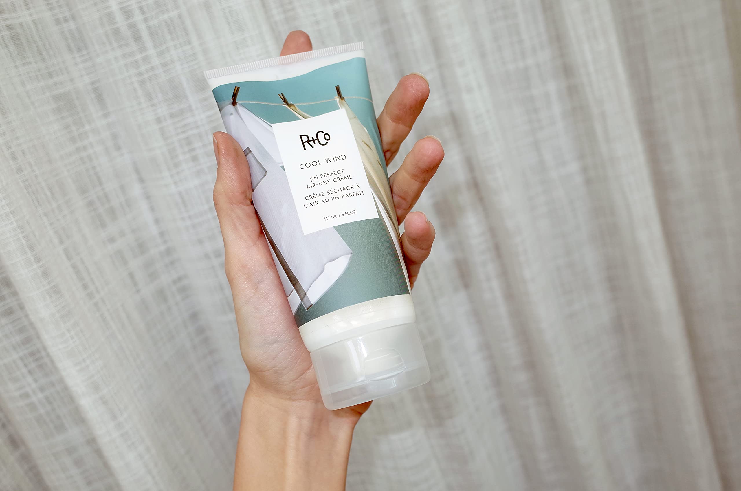 R+Co Cool Wind mango butter for detangling and manageability.
