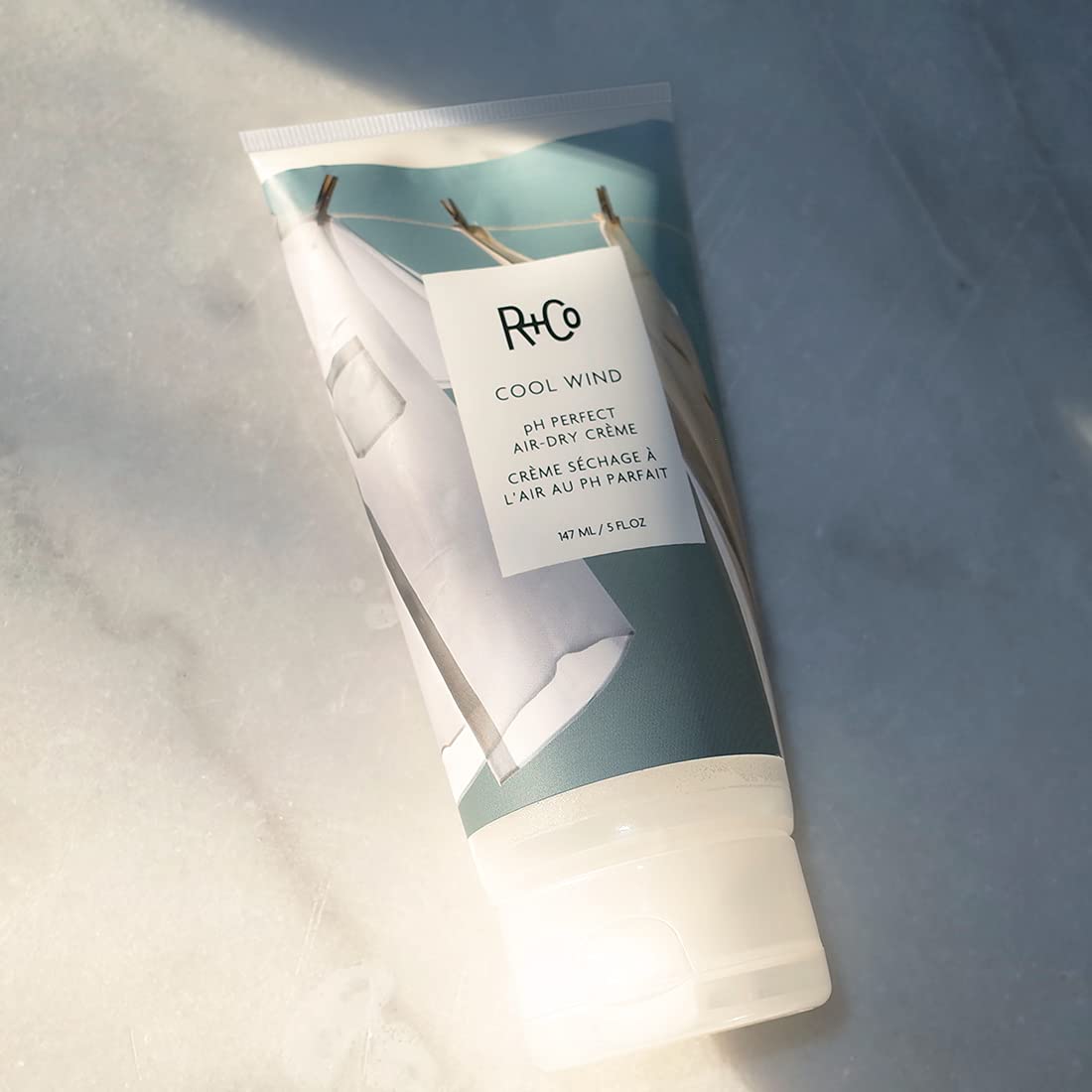 R+Co Cool Wind pump application showing smoothing while applying cream.