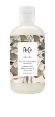 R+Co Dallas Thickening Shampoo bottle close-up highlights volumizing care for fine hair.