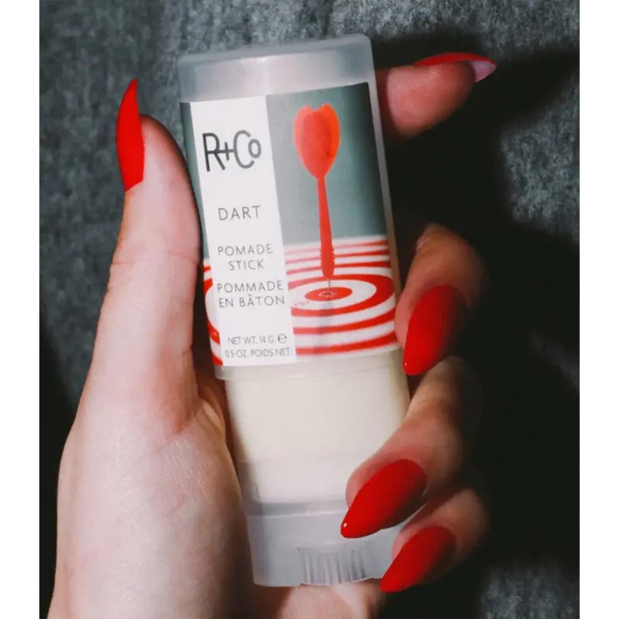 R+Co Dart Pomade Stick flyaway-control demonstrates tame flyaways with precision.