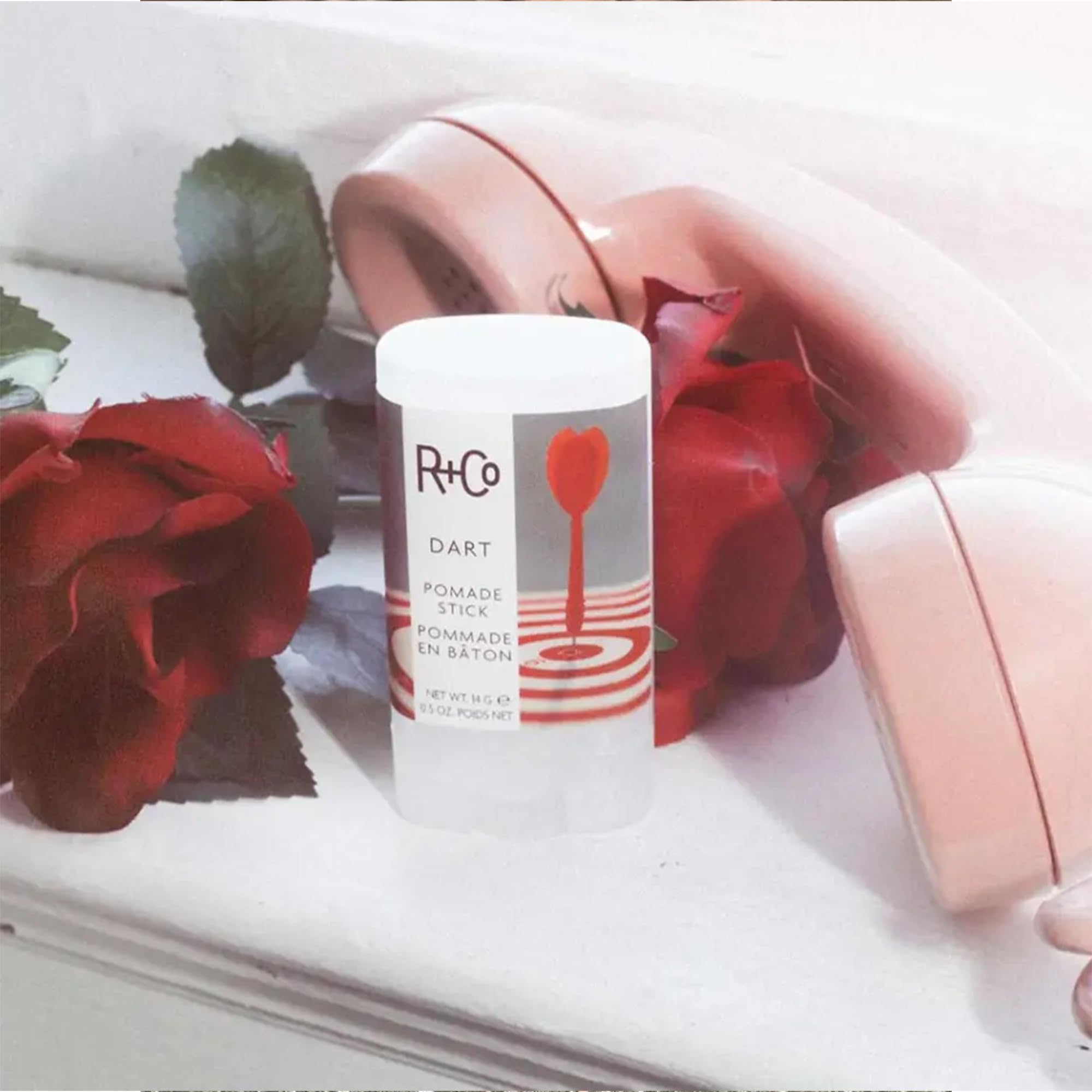R+Co Dart Pomade Stick packaging-closeup shows premium Leaping Bunny branding.