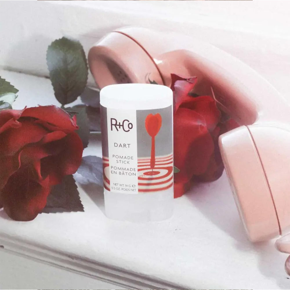 R+Co Dart Pomade Stick packaging-closeup shows premium Leaping Bunny branding.