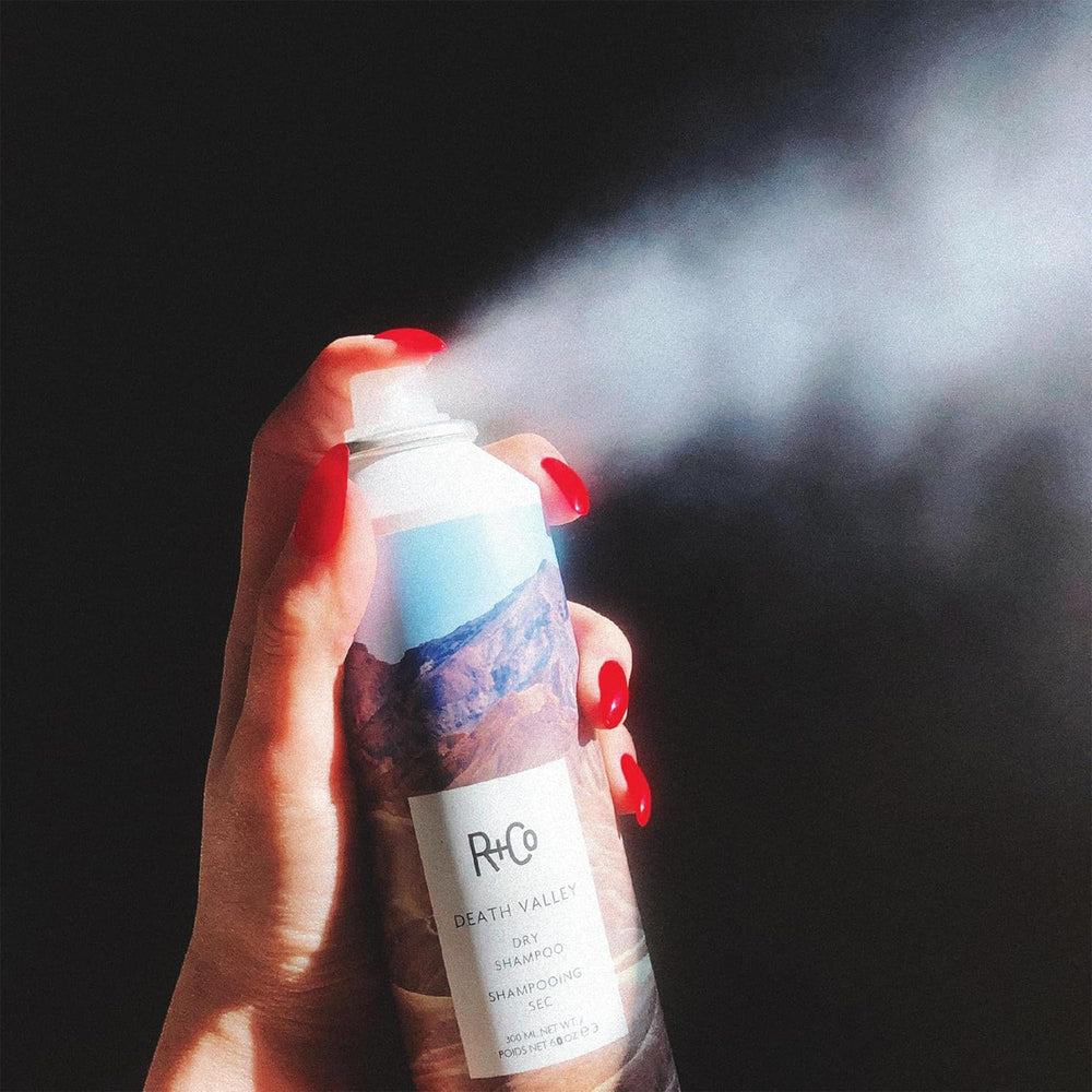 R+Co Death Valley Dry Shampoo dabbed on hair for renewed feel