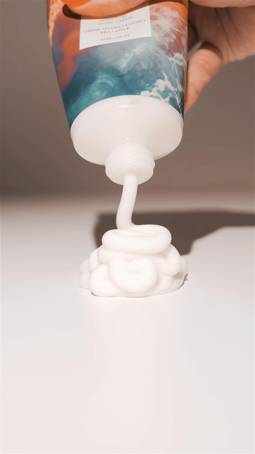 R+Co HIGH DIVE frizz-free smooth hair closeup shows control