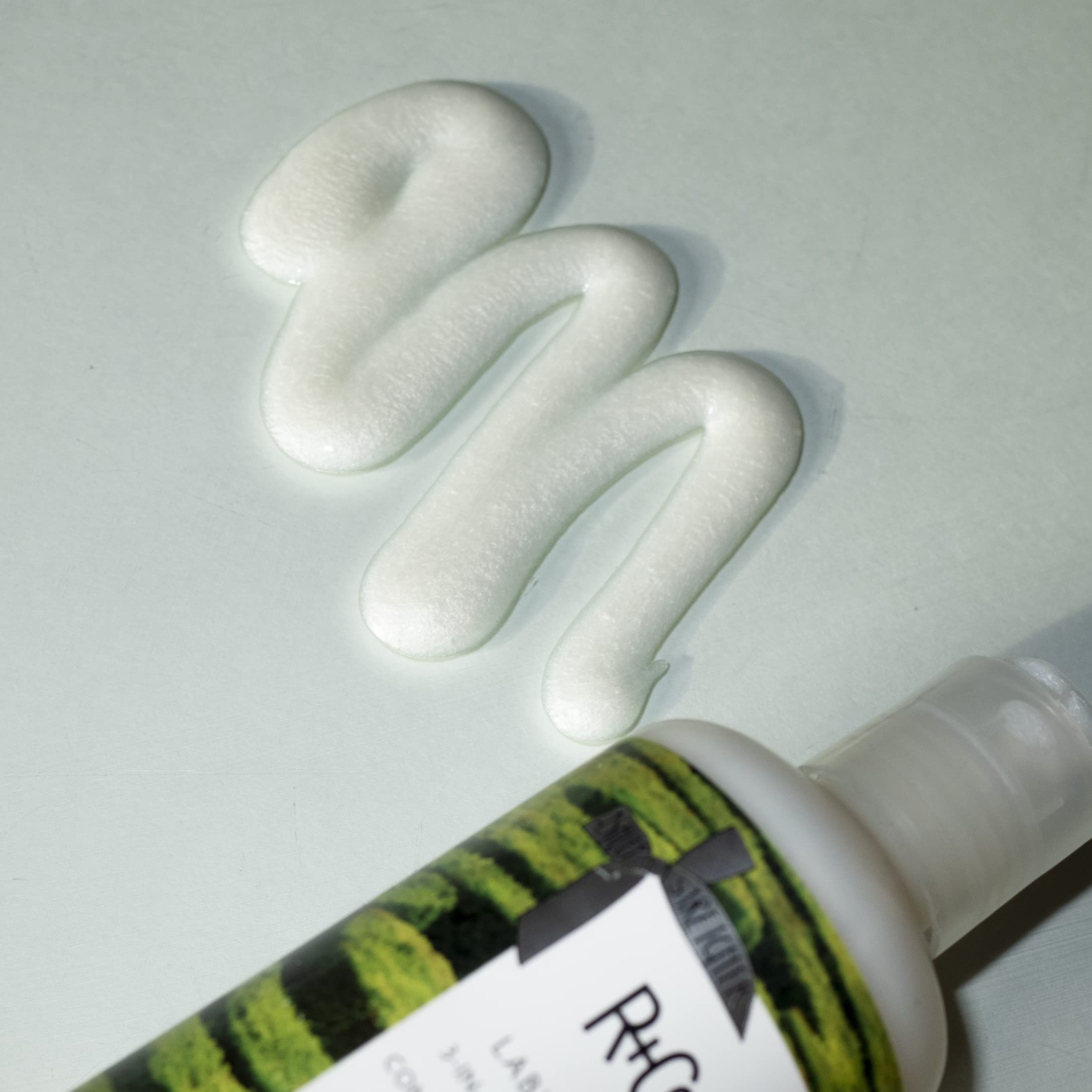 R+Co Labyrinth bottle back label reveals the plant-infused formula for hydrated, touchable texture.