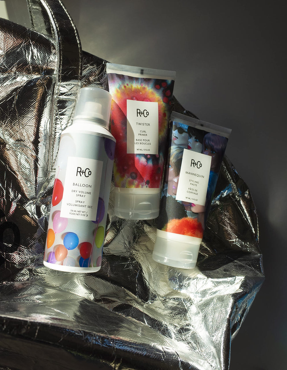 r+co mannequin styling paste bottle close-up catching light to hint natural shine.
